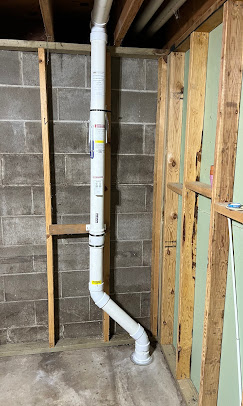 Interior radon pipe framed wall