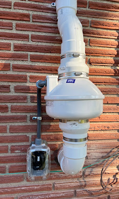 Radon fan on brick with manometer